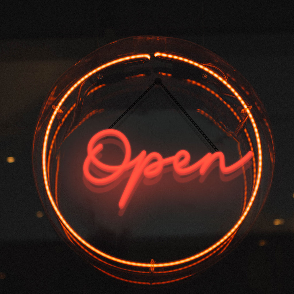 red open neon sign for business