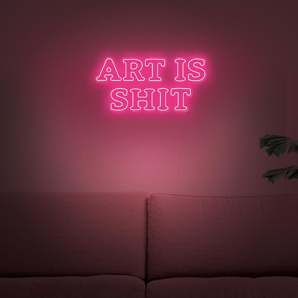 led neon sign with letters ART IS SHIT