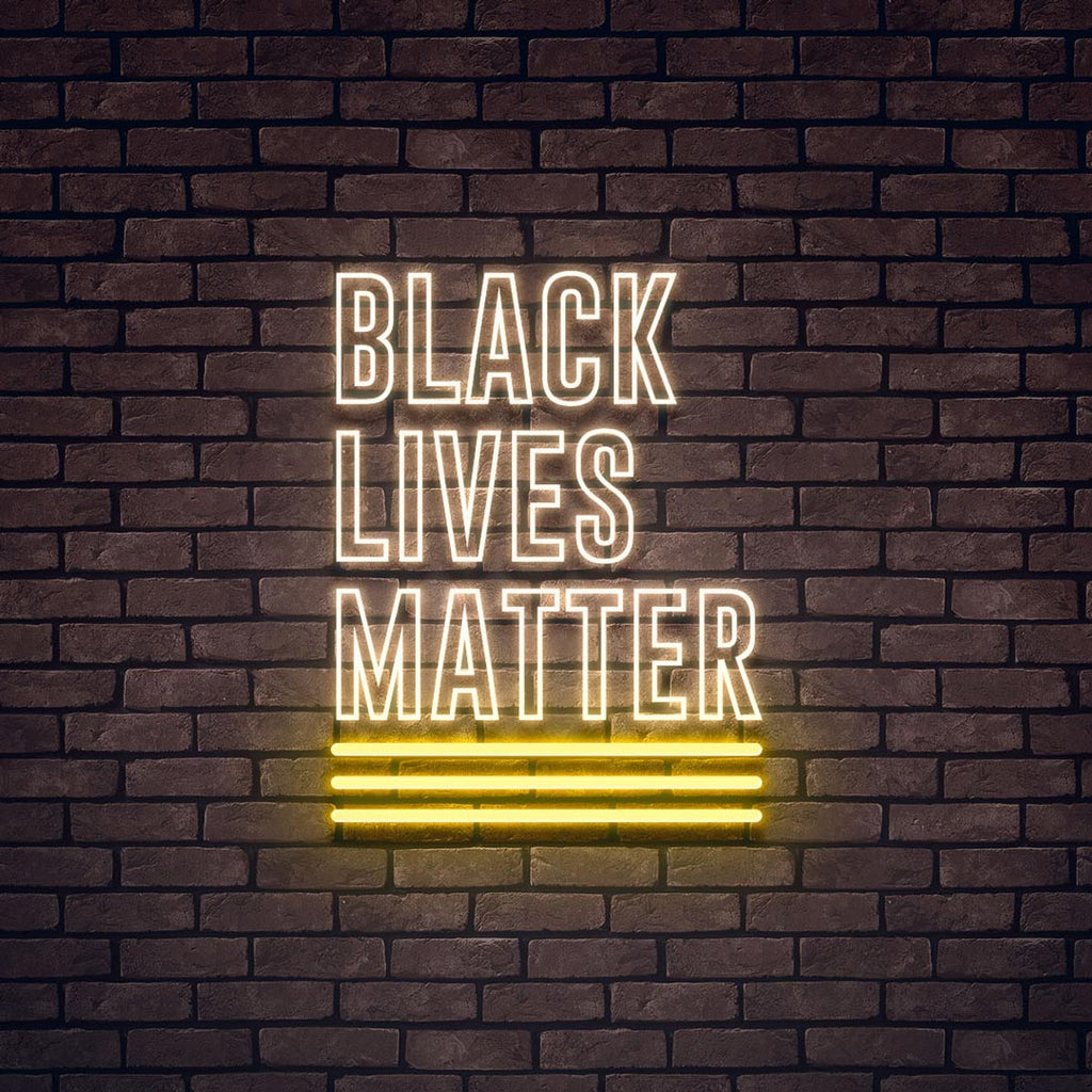 a text led neon sign, first line letters are BLACK, second letters are LIVES, third are MATTER