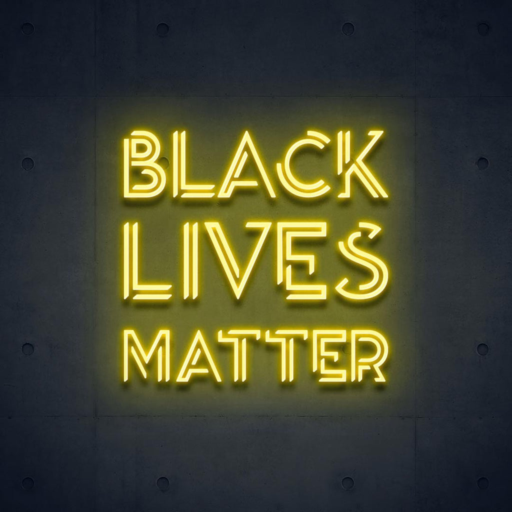 a yellow led neon sign with letters of BLACK LIVES MATTER