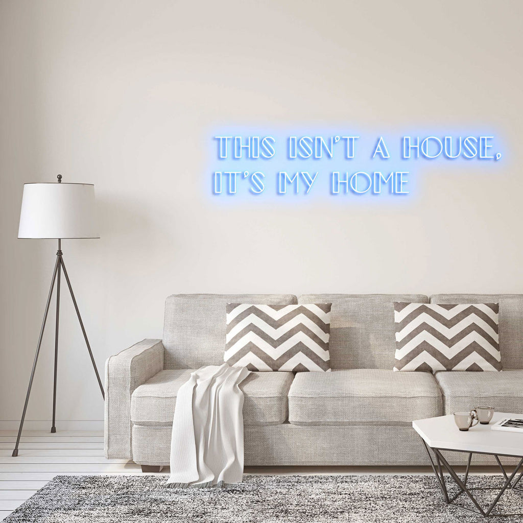 sky blue led neon sign of text THIS ISN'T A HOUSE, IT'S MY HOME