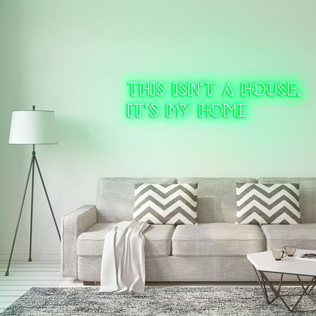 green led neon sign of text THIS ISN'T A HOUSE, IT'S MY HOME