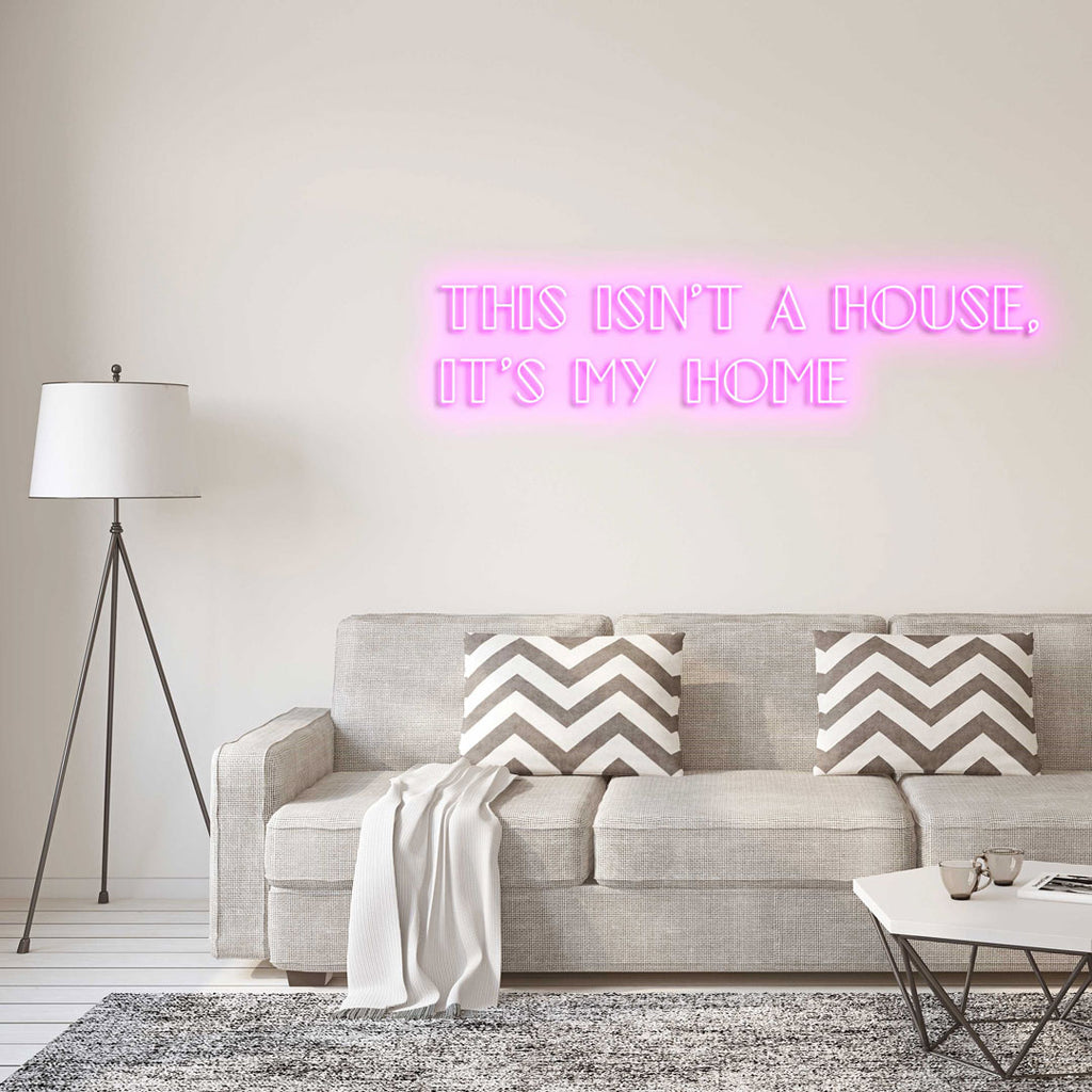 light pink led neon sign of text THIS ISN'T A HOUSE, IT'S MY HOME