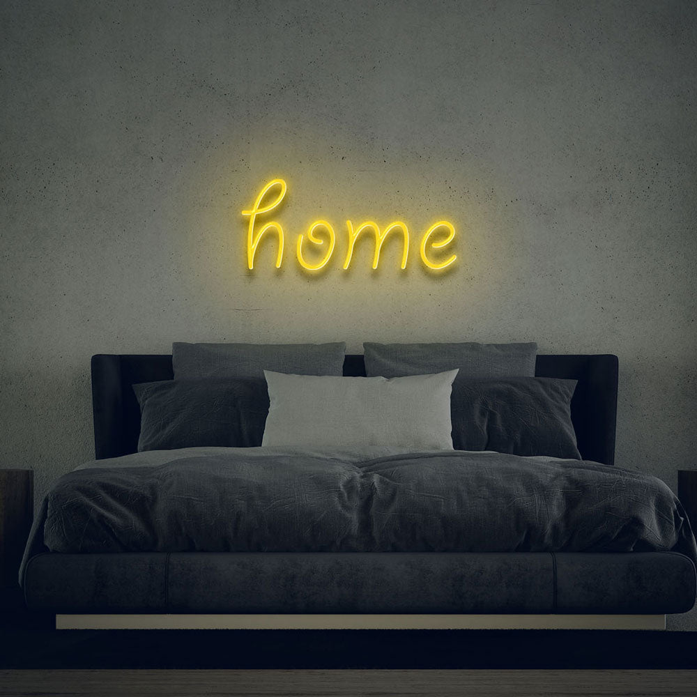 yellow led neon sign of text home