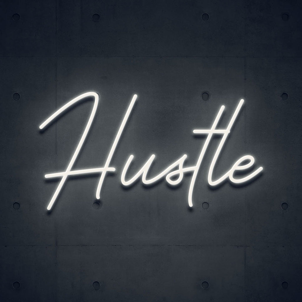 white led neon sign of text hustle