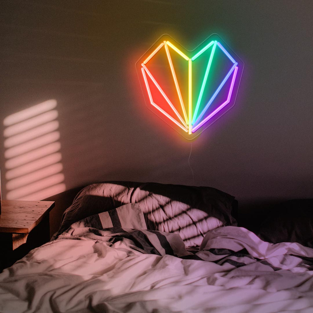 a geometrical heart neon sign with rainbow color or red, orange, yellow, blue and purple