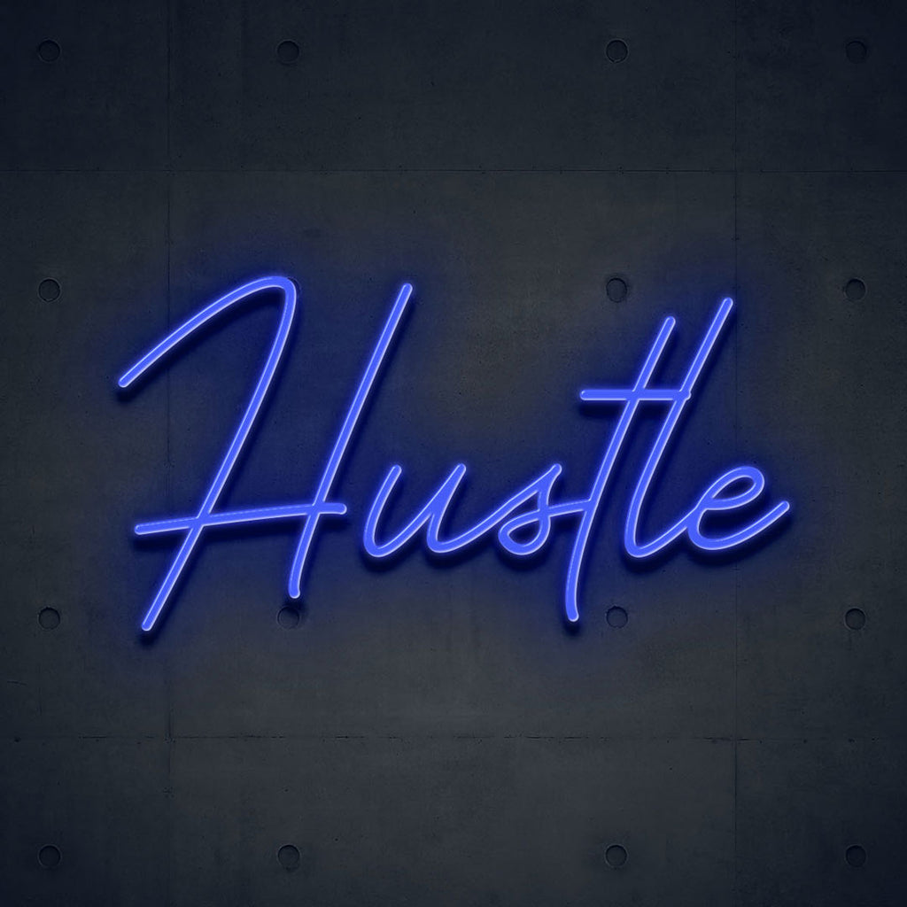 indigo led neon sign of text hustle