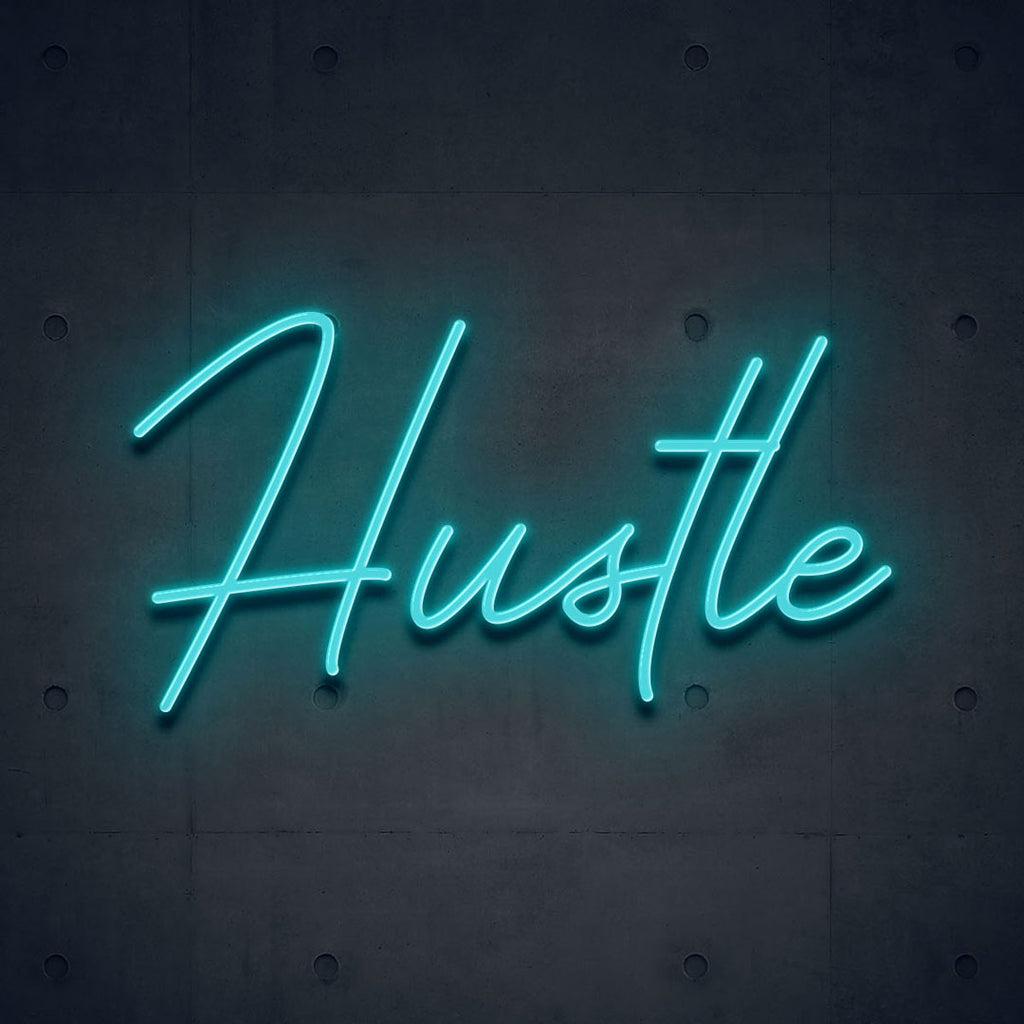 light blue led neon sign of text hustle