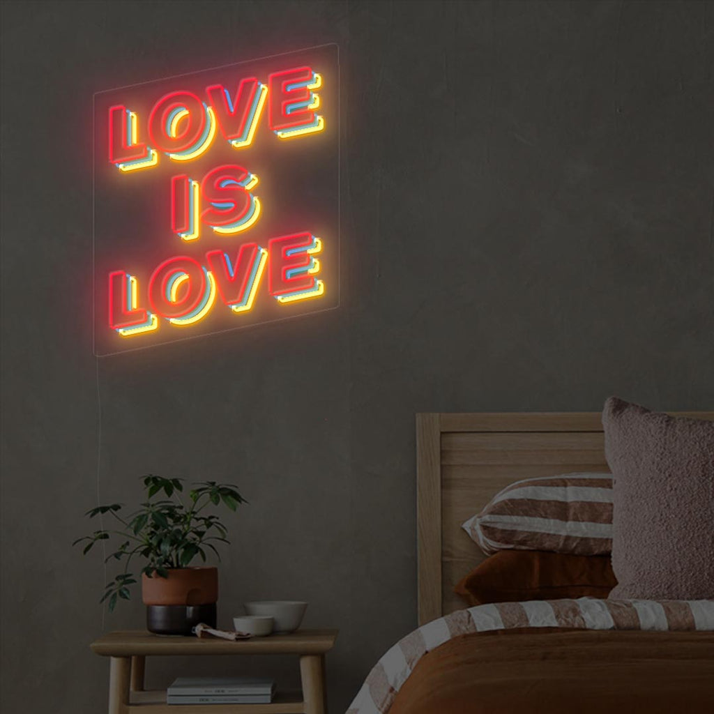 love is love neon sign with the color of red, blue and yellow